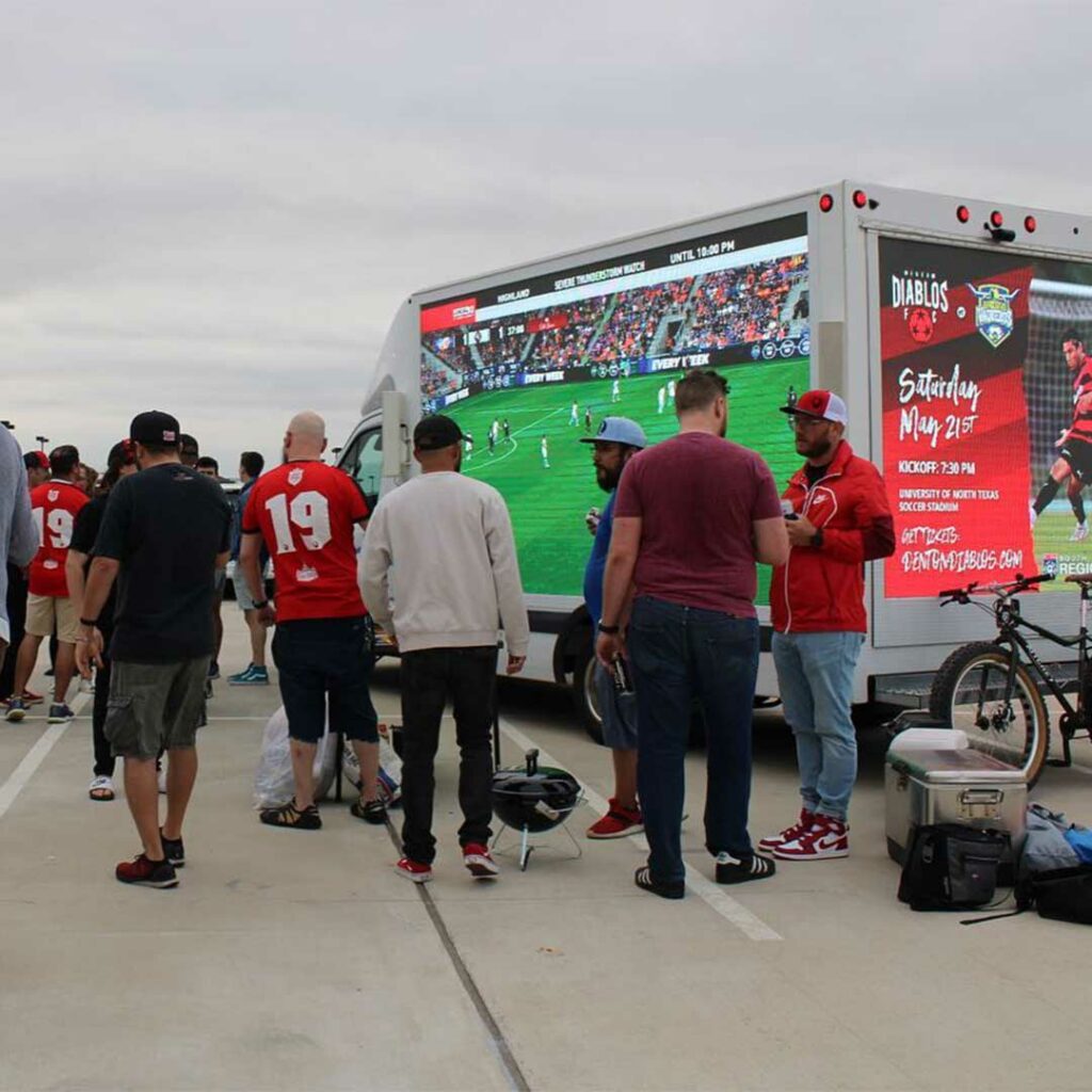 The BrandVan livestreaming a soccer game in the parking lot, for those fans who were unable to get tickets.