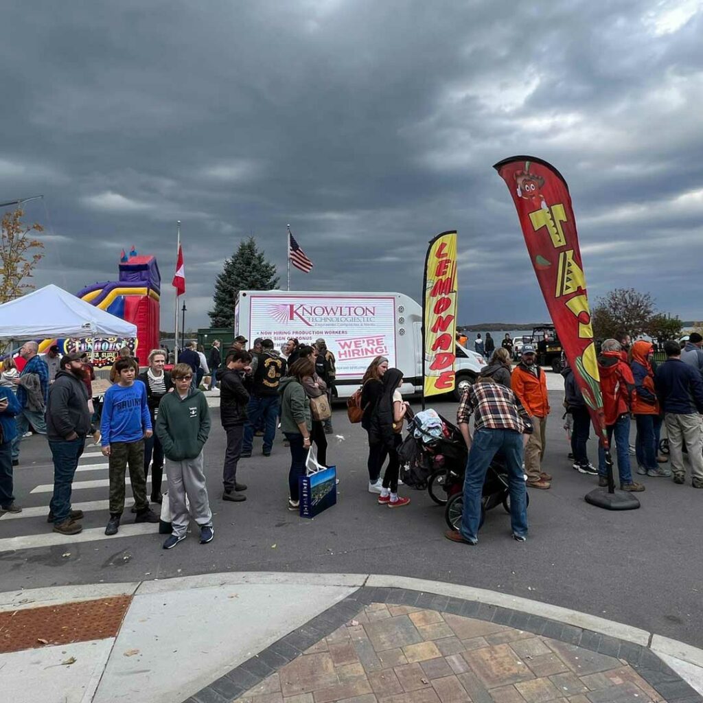 The BrandVan at a town event displaying advertisments for local businesses